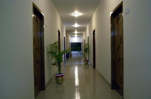 a room with a door leading to a hallway at Hotel Supreme in Sylhet