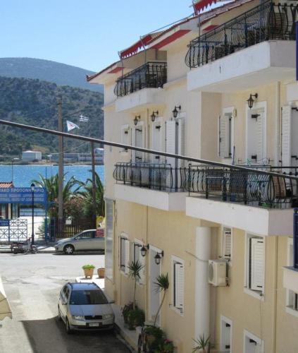 a car parked in a parking lot next to a building at King A in Argostoli