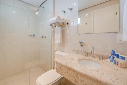 a bathroom with a sink and a toilet and a shower at Blue Tree Towers All Suites Santo André in Santo André