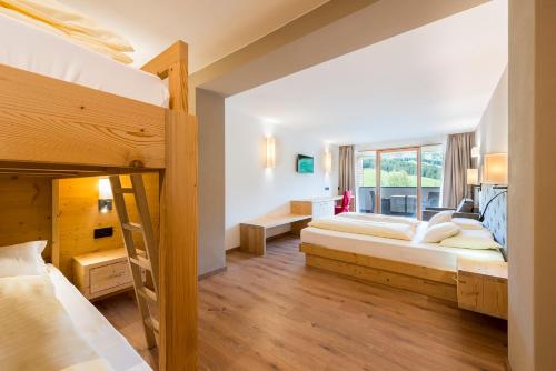Posteľ alebo postele v izbe v ubytovaní Hotel Cavallino