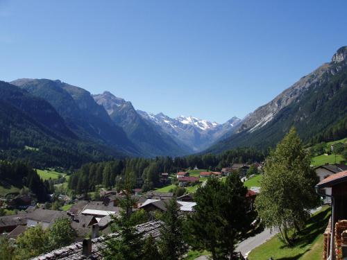 a village in a valley with mountains in the background at Haus Sonnleite in Trins