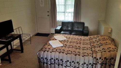 Postel nebo postele na pokoji v ubytování Stonehaven Motel