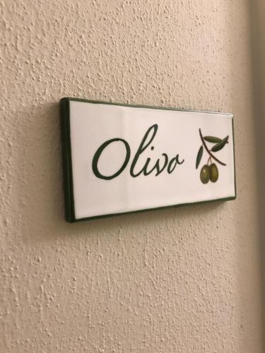 a sign on a wall with olives on it at Agriturismo La Rinaldina in Faenza