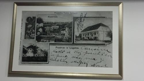 a framed picture of a document on a wall at Villa Tollazzi in Logatec