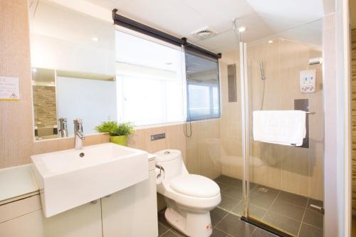 a bathroom with a toilet and a sink and a shower at Click Hotel - Taipei Main Station Branch in Taipei