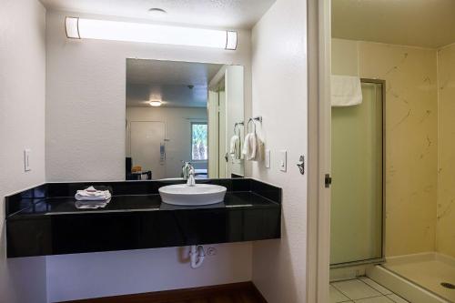 a bathroom with a sink and a mirror at Motel 6-Ventura, CA - Downtown in Ventura