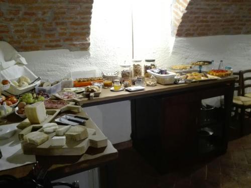 a table with a bunch of food on it at Il Vecchio Mulino Di Bairo in Bairo