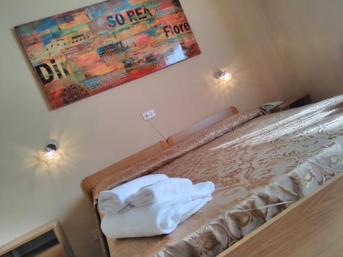 Ένα ή περισσότερα κρεβάτια σε δωμάτιο στο Hotel Eva La Romantica