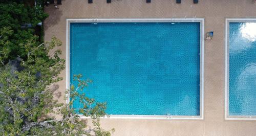 a large blue screen on the side of a building at Muong Thanh Luxury Buon Ma Thuot Hotel in Buon Ma Thuot