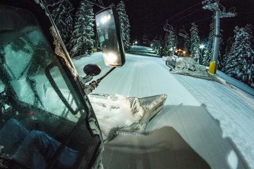 a car parked on a snow covered road at The Stone Villa in Beli Iskar