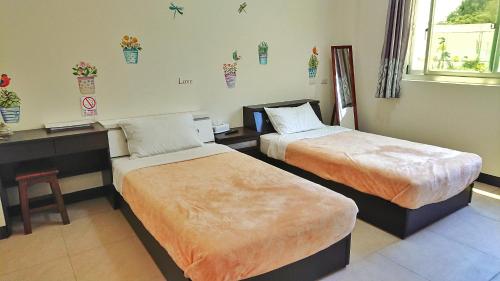 Кровать или кровати в номере Jin Dun Yuan