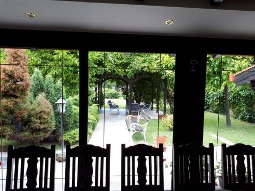 a view of a patio through a glass door at Business Club Selenča in Bač