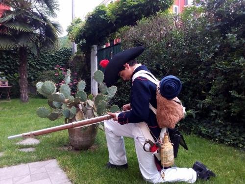 a man dressed in a pirate costume looking at a cactus at Al Giardino degli Artisti in Cairo Montenotte