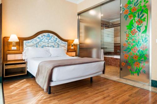 Giường trong phòng chung tại Hotel Julia