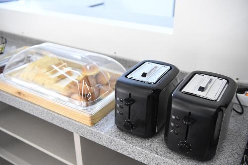 two toasters sitting on top of a counter at The Beauty Hotel in Gangneung
