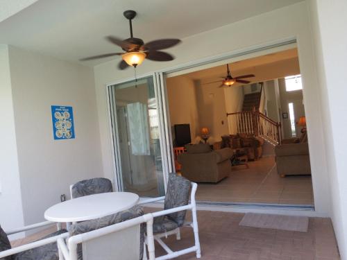a dining room and living room with a table and chairs at Formosa Garden Pool Home in Orlando