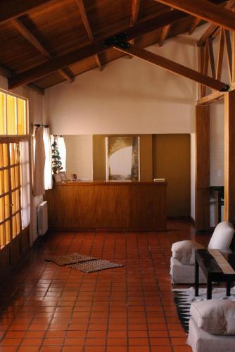 a living room with a couch and a mirror at Hotel de Las Nubes in San Antonio de los Cobres