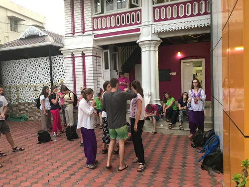 a group of people standing outside of a building at Palm Rivera Kochi in Cochin