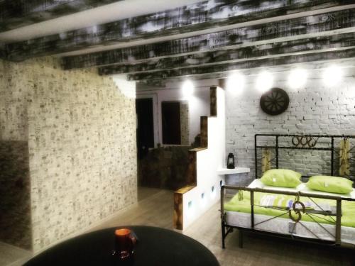 a room with two bunk beds in a brick wall at Апартаменты Loft in Kansk