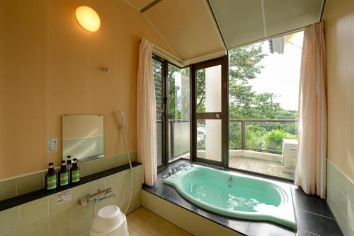 Kylpyhuone majoituspaikassa Le Nessa Jyogasaki