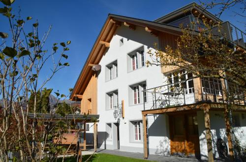 an external view of a white building at Mountain-Panorama in Meiringen