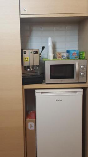 Kuchyň nebo kuchyňský kout v ubytování Marcelina vaticans rooms