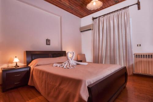 Ένα ή περισσότερα κρεβάτια σε δωμάτιο στο Fouxia Apartments and Studios 