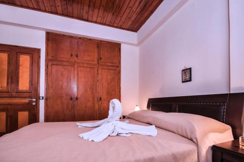 Ένα ή περισσότερα κρεβάτια σε δωμάτιο στο Fouxia Apartments and Studios 