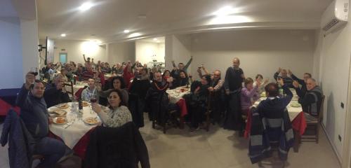 a large group of people sitting at tables in a room at Camping Lido di Salerno in Pontecagnano