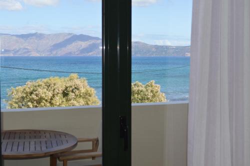 a view of the ocean from a balcony at Christina Beach Hotel in Kissamos