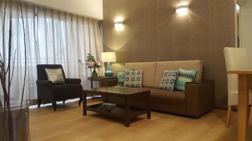 Χώρος καθιστικού στο Batu Ferringhi Seaview Apartment