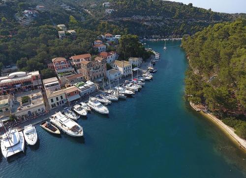 a group of boats are docked in a river at Averto Avali in Gaios