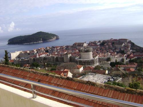 a view of a city and the ocean at Apartments Simic in Dubrovnik