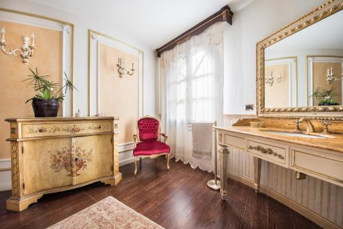 a bathroom with a sink and a mirror at villa Maiani Travelmoods villas in Mazara del Vallo