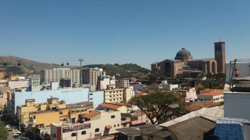 a view of a city with buildings at Hotel Santa Rita in Aparecida