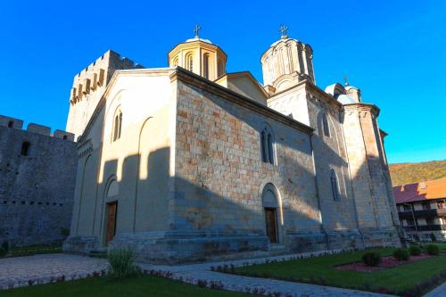 an old church with two towers on top of it at Etno domaćinstvo Milenković in Despotovac