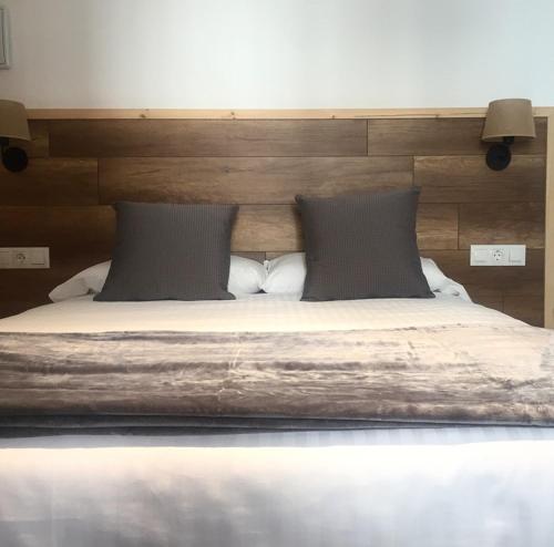 Postel nebo postele na pokoji v ubytování Hotel Roca