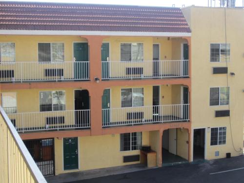 an apartment building with balconies on the side of it at Starlight Inn, Valley Blvd - Downtown LA in Los Angeles