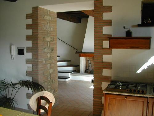 a kitchen with a counter and a stove top oven at Agricola Caicucci in Montone