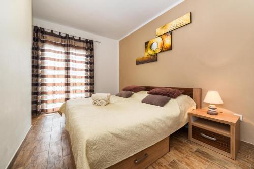 Posteľ alebo postele v izbe v ubytovaní Apartments Sea Vodice