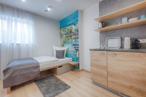 Postel nebo postele na pokoji v ubytování Pension Breitenauer See