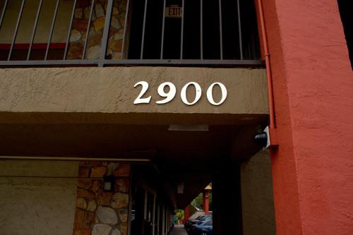 a sign on the side of a building at Polynesian Inn in Saint Cloud