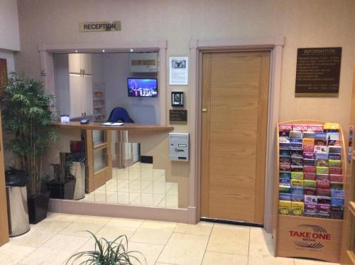 a store with a take out counter and a door at Central Hotel in London
