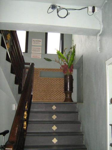 a stairway with a vase with a plant in it at Lamoon Lamai Residence & Guesthouse in Lamai