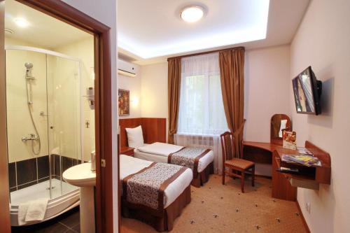 Кровать или кровати в номере Отель «НеЧаев»