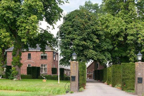 a brick building with a street light in front of it at Appartementen Rijnhoeve in Koudekerk aan den Rijn