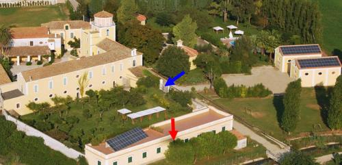 an aerial view of a house with solar panels on it at Farmstay La Morella in Battipaglia