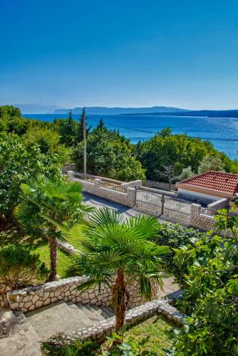 an aerial view of a house with trees and the ocean at Lux dodo in Dramalj