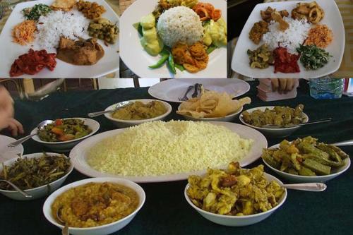 a table with plates of food and bowls of rice at Mountain White Villa by Sunrise in Kandy