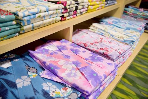 a shelf filled with colorful blankets at Mikasa in Nara